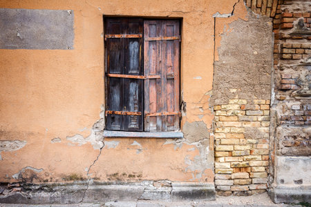 Boarded up window of a abandoned house