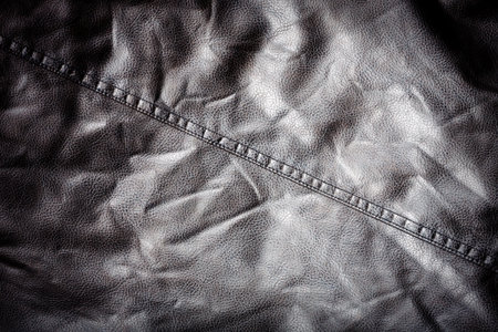 black crumpled leather texture backgroundの写真素材