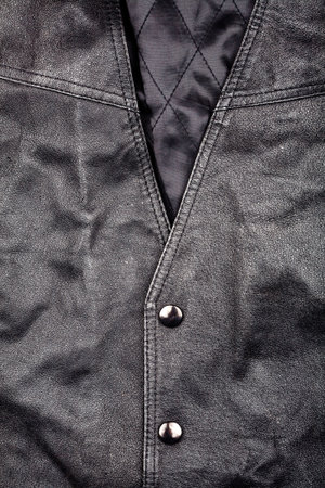 Fragment of black leather vestの写真素材