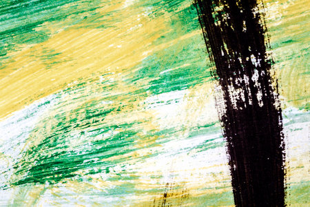Abstract hand painted yellow green and black colors art backgroundの写真素材