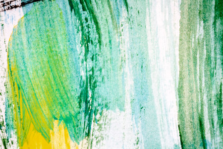 Abstract hand painted yellow green and black colors art backgroundの写真素材
