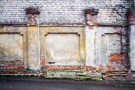 Old weathered wall of bricks and a groundの写真素材