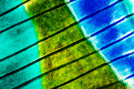 Closeup shot of glazed green and blue ceramics textureの写真素材