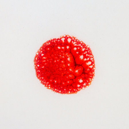 Closeup shot of glazed white ceramics texture with red circle in the middle