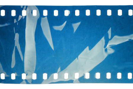 Blank crumpled noisy blue filmstrip isolated on white backgroundの写真素材