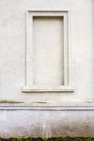 Detail of an old white cement wall textureの写真素材