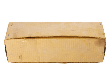 Old dusty brown cardboard box isolated on white backgroundの写真素材