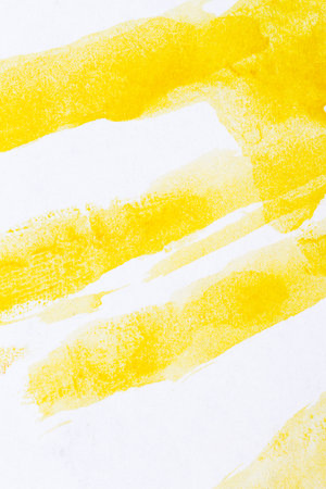Abstract hand drawn yellow watercolor paints backgroundの写真素材