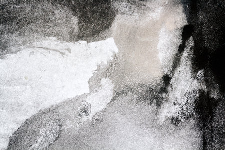 Macro shot of abstract black hand painted watercolor texture. Abstract aquarelle background.