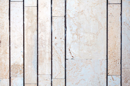 Old stone tile wall texture backgroundの写真素材