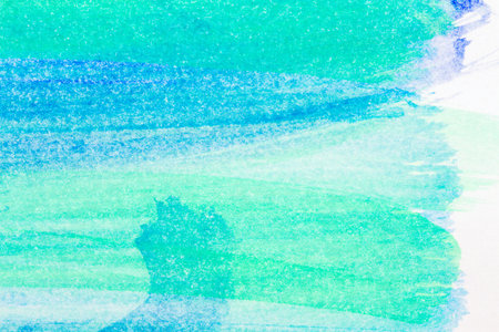 Macro shot of abstract hand drawn blue and green watercolor paints backgroundの写真素材