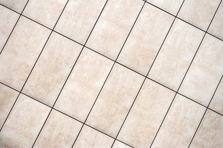Detail of light beige tile wall texture backgroundの写真素材