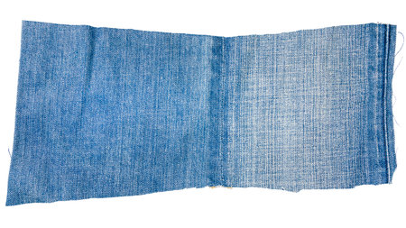 Piece of light blue jeans fabric isolated on white background. Rough uneven edges.
