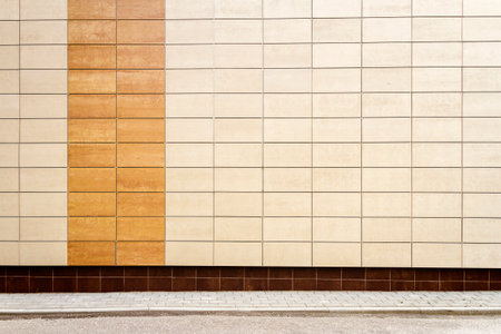 Modern beige metal facade tiles wall and a ground. Abstract architecture background