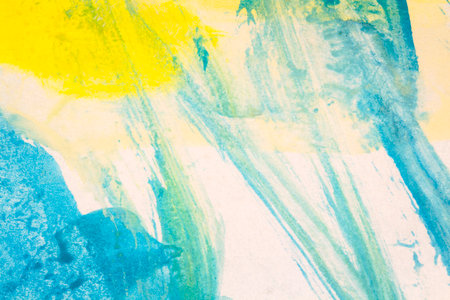 Abstract hand drawn blue and yellow watercolor paints backgroundの写真素材