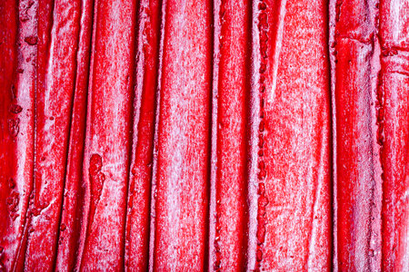 Red bumpy wall stucco texture background, crumpled leather imitationの写真素材