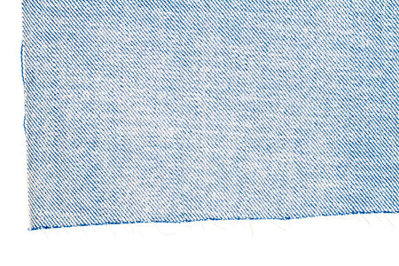 Piece of blue jeans fabric isolated on white background. Rough uneven edges. Wrong side of fabric