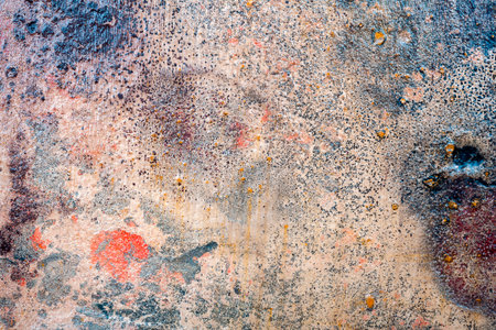 Yellow brown and red messy wall stucco texture background. Decorative wall paint.