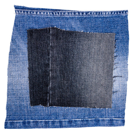 Two pieces of jeans fabric isolated on white background. Rough uneven edges. Denim jeans torn