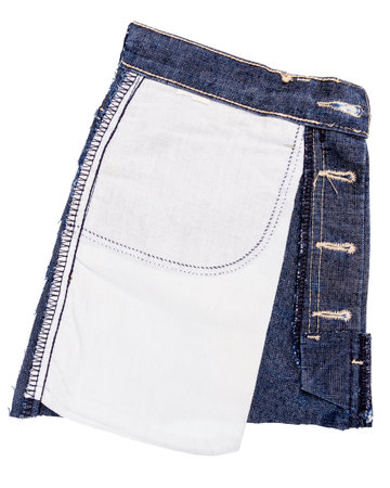 Piece of blue jeans fabric isolated on white background. Rough uneven edges. Denim jeans torn. Wrong side of jeans fabricの写真素材