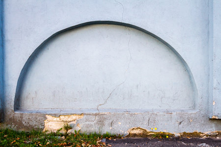Old plastered weathered street wall background. Architectural detail.の写真素材