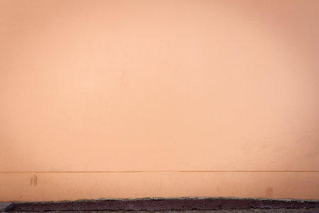 Pink plaster street wall background. Architecture detail.の写真素材