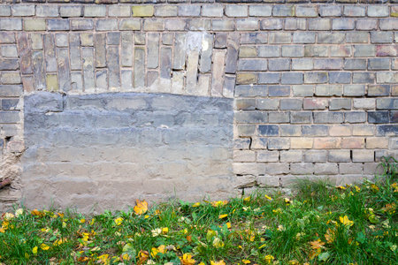 Old abandoned wall with bricked up window. Architecture detail background.の写真素材
