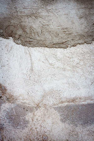 Gray uneven concrete wall texture background. Old gray concrete wall for abstract background.の写真素材