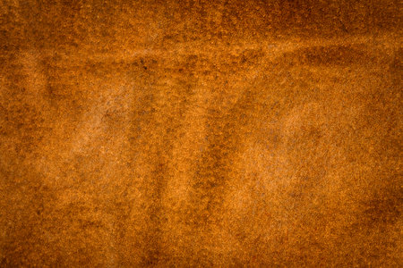 Genuine brown leather texture background. Abstract vintage natural cow skin backdrop.の写真素材