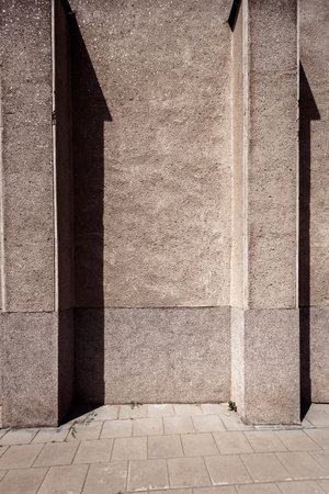 Old weathered street wall with two columnsの写真素材