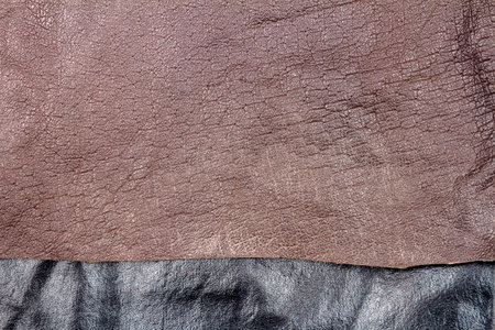Genuine brown and black leather texture background. Abstract vintage natural cow skins backdrop.