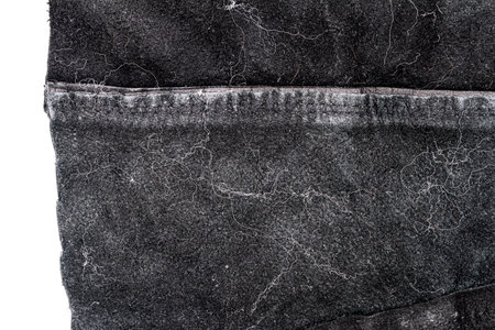 Piece of messy black leather isolated on white background. Crumpled material texture. Back sideの写真素材