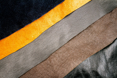 Genuine brown and black leather textures background. Abstract vintage natural cow skins backdrop....
