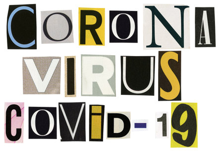 Corona virus COVID-19 text made of newspaper clippings isolated on white background.の写真素材