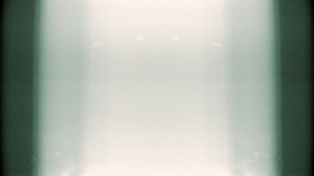 Noisy film frame with heavy scratches, dust and fingerprint. Abstract old film background