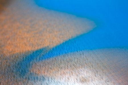 Macro shot of blue and orangevinyl record. Surface of an old vinyl record. Shallow deph of field.の写真素材