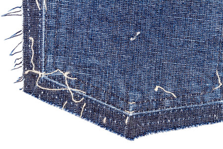 Part of blue denim jeans back pocket isolated on white background.