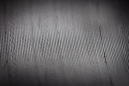 Macro shot of black vinyl record. Surface of an old vinyl record. Shallow deph of field.