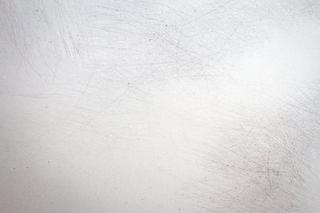 Abstract gray scratched film texture background with heavy grain, dust and light leakの写真素材