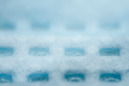 Protective, disposable light blue face mask. Extreme close-up macro photography. Selective focus.の写真素材