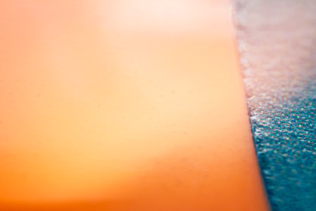 Macro shot of blue and orange vinyl record. Surface of an old vinyl record. Shallow deph of field. Selective focus.の写真素材