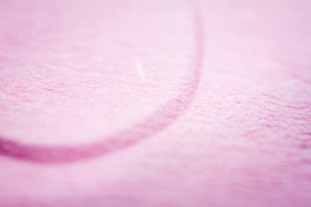 Extreme macro of embossed pink paper. Selective focus, shallow depth of field.の写真素材
