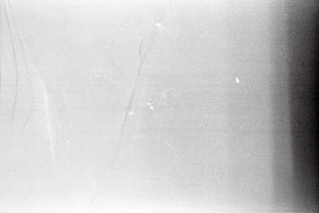 Blank grained film strip texture background with heavy grain and dustの写真素材