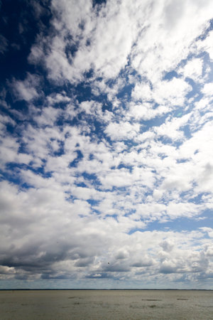 Kursiu Marios and a blue sky with clouds in Lithuaniaの写真素材