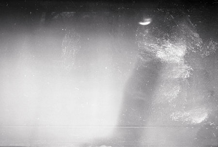 Blank grained film strip texture background with heavy grain and dustの写真素材