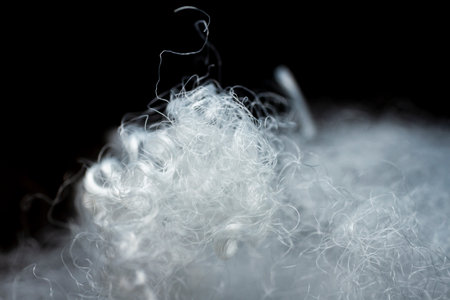 Extreme macro of polyester stable fiber. Selective focus, shallow depth of field.