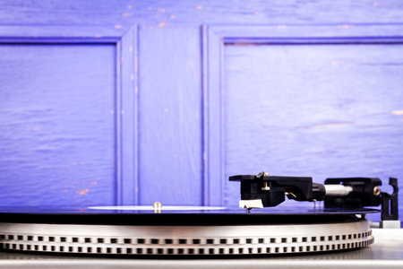 Close up of vintage turntable vinyl record player. Retro audio equipment.