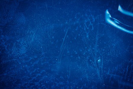 Blank grained toned film strip texture background with heavy grain, dust and light leak