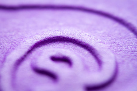 Extreme macro of embossed purple paper. Selective focus, shallow depth of field.