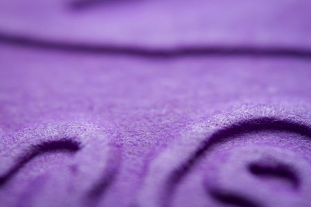 Extreme macro of embossed purple paper. Selective focus, shallow depth of field.の写真素材